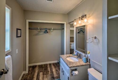 a bathroom with a sink and a mirror at Charming Texas Home with Stunning Canyon Views! in Canyon