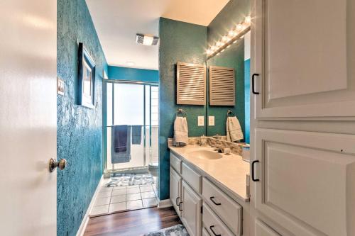 a bathroom with a sink and a mirror at Balcony, Pool and Hot Tub Cozy Condo in Arkansas! in Lake Hamilton