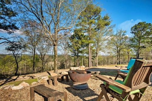 a yard with a bench and a fire pit at Broken Bow Mountaintop Home with Hot Tub! in Broken Bow