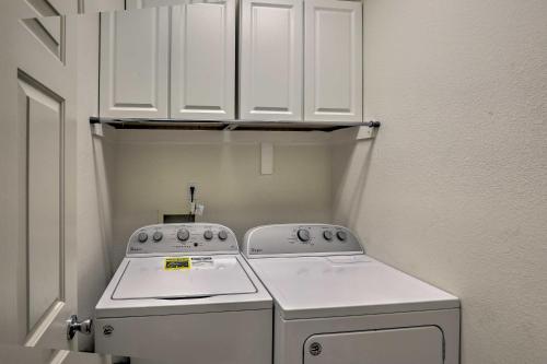 a small kitchen with a stove and a sink at Tucson Getaway with Yard, Pool, Hot Tub and Gas Grill! in Tucson