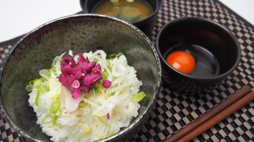 a bowl of rice and vegetables on a table at HOTEL Artia Ogaki (Adult Only) in Ogaki