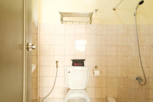 a bathroom with a toilet with a walk in shower at RedDoorz Plus @ Seaborne Hotel Subic Zambales in Subic
