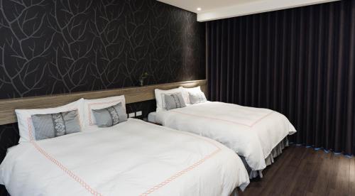 Postel nebo postele na pokoji v ubytování Tianli Hotel