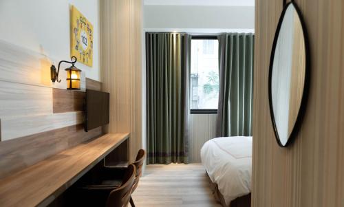 Postel nebo postele na pokoji v ubytování Tianli Hotel