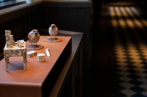 two birds sitting on top of a table at The Hotel Seiryu Kyoto Kiyomizu - a member of the Leading Hotels of the World- in Kyoto