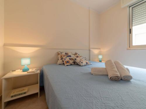 A bed or beds in a room at Bright Apartment Near The Beach In Otranto