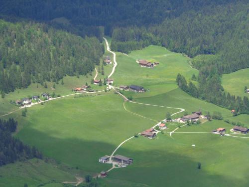an aerial view of a farm in a green field at Bichlhof Riedenberg in Thiersee