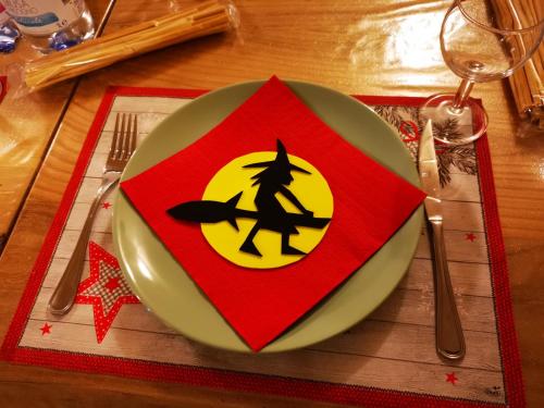 a plate with a witch sign on top of a table at Masseria Le Querciole in Fauglia