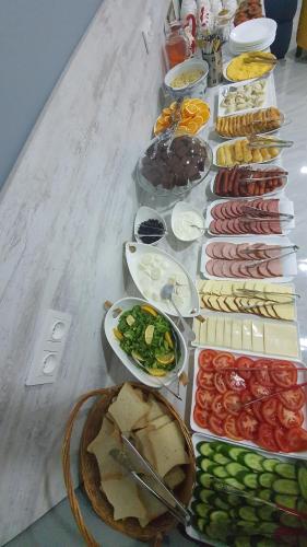 a table with many different types of food on it at Mestia 4 season in Mestia