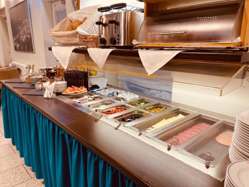 a buffet line with different types of food at Hotel Arena in Cologne