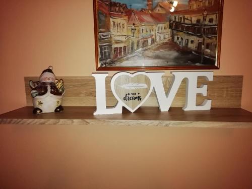 a shelf with a sign that says i love at Studio apartment Meli in Ogulin