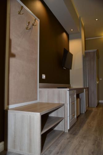 a bathroom with a sink and a mirror at The King Resort in Tirana