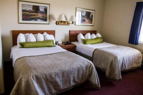 Tempat tidur dalam kamar di Candlewood Suites Syracuse-Airport, an IHG Hotel