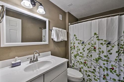 a bathroom with a sink and a shower curtain at Estacada Home - Near Milo McIver State Park! in Estacada