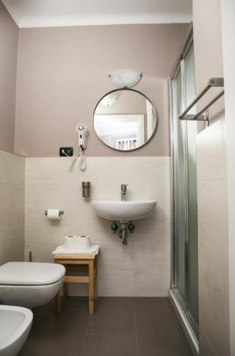 a bathroom with a sink and a mirror at Vernazza2010 Rooms in Vernazza