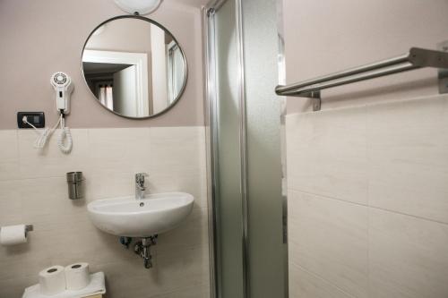 a bathroom with a sink and a mirror at Vernazza2010 Rooms in Vernazza