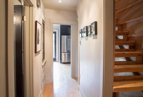 a hallway with stairs in a house at Updated Tacoma Home with Patio 3 Mi to Downtown in Tacoma