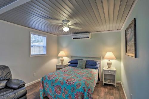 a bedroom with a bed and a ceiling fan at Shady Rest Studio 6 Mi to Ocean Isle Beach! in Shallotte