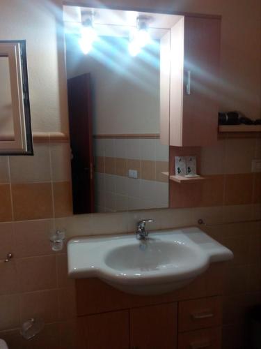 a bathroom with a sink and a mirror at B&B Trinacria Modica in Modica