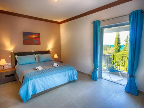 a bedroom with a bed and a sliding glass door at Spacious 4-Bedroom Villa with Private Pool and Stunning Sunset Views, 3 Minutes from the Beach in Afionas