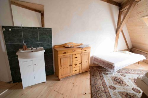 a bathroom with a sink and a toilet in a room at Zamek Usobi in Úsobí