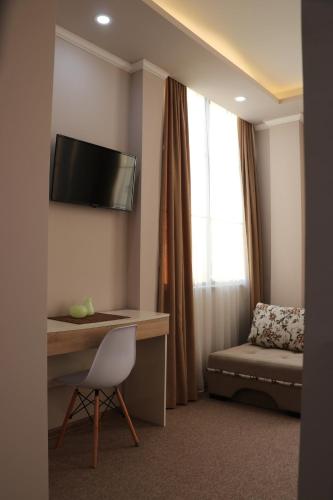 a room with a desk and a chair and a window at Riva in K'obulet'i