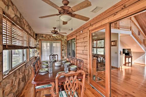 a dining room with a table and a ceiling fan at 40-Acre Farm with Animals and Fishing in Sebring! in Sebring