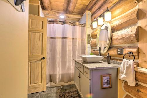 a bathroom with a sink and a mirror at Secluded Traverse City Retreat - Near Downtown! in Traverse City