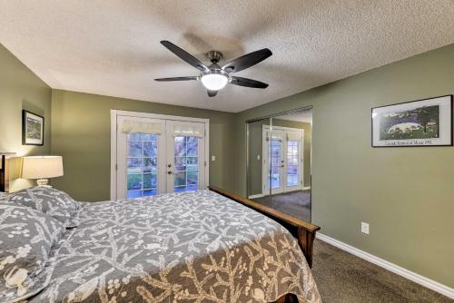 a bedroom with a bed and a ceiling fan at Central Medford Family Retreat with Large Yard! in Medford