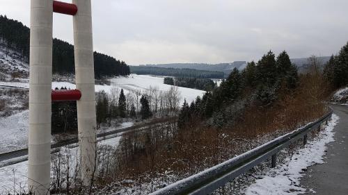 a view of a river with snow on the ground at Ferienwohnung Müller in Bestwig