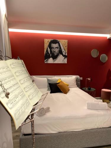 Letto o letti in una camera di Dimora del Teatro