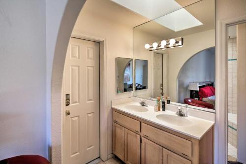 a bathroom with a sink and a mirror at Patio, Rooftop Deck and Mtn Views Lake Havasu Home! in Lake Havasu City