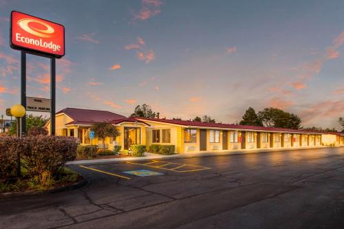 a fast food building with a sign in a parking lot at Econo Lodge in Norwalk
