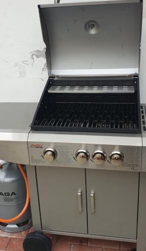 a stove top oven sitting on top of a counter at Apartmány Centro & Jacuzzi in Piešťany