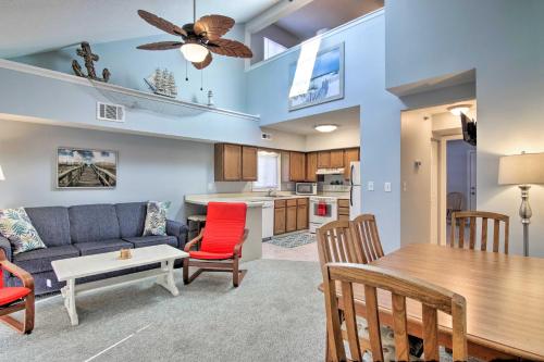 a living room with a couch and a table at half Mi to Maryland Beach Family Condo with Balcony in Ocean City
