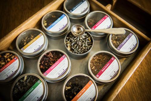 a tray filled with different types of seeds and a spoon at Prins Hendrik Texel in Oost