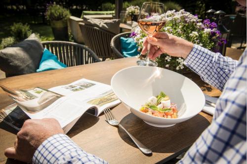 two people sitting at a table with a bowl of food at Prins Hendrik Texel in Oost