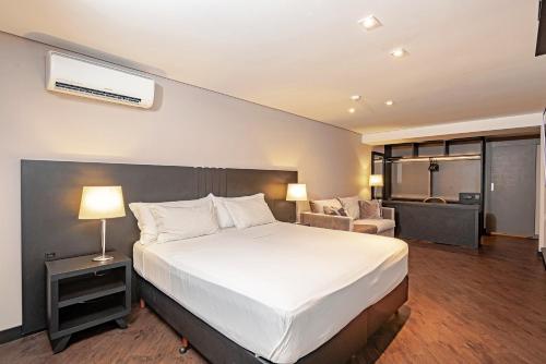 
Cama ou camas em um quarto em Slaviero Baía Norte Florianópolis
