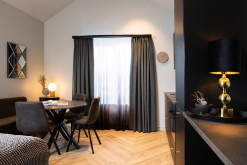 a room with a table and a dining room at Backyard Apartments by Heimaleiga in Reykjavík