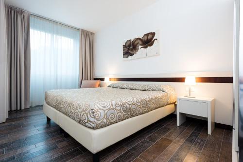 Katil atau katil-katil dalam bilik di Aparthotel Holiday