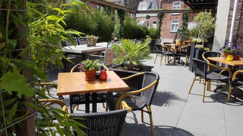 Restaurant ou autre lieu de restauration dans l'établissement Hotel Stadsherberg Sneek