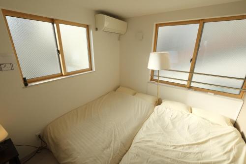 Cama o camas de una habitación en LN05 New Home in Sannomiya with Own Car Park