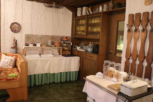a kitchen with a table and a room with a tableablish at Pension Zöllner Garni in Weismain