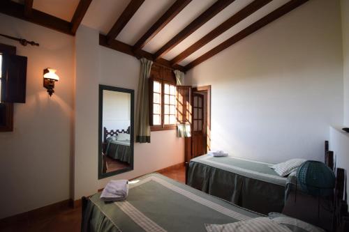 Giường trong phòng chung tại Villa Altos de Santiago