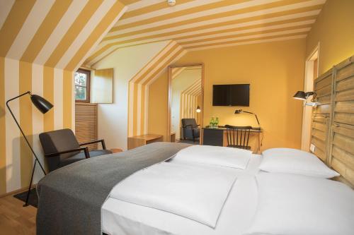 Ένα ή περισσότερα κρεβάτια σε δωμάτιο στο Hotel Schloss Leopoldskron