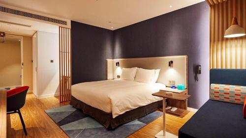 Tempat tidur dalam kamar di Holiday Inn Express Shijiazhuang High-tech Zone, an IHG Hotel