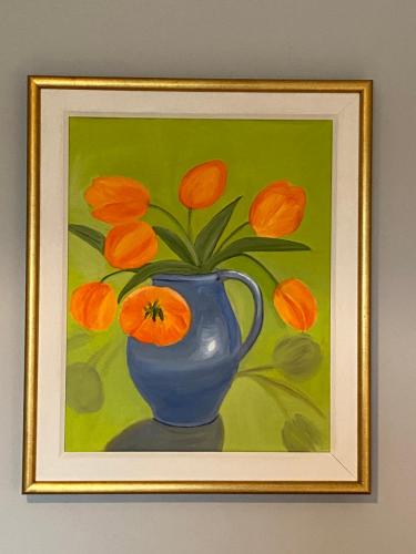 a painting of a blue vase with orange flowers at River Meadows B&B in Kenmare