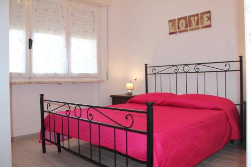 Postel nebo postele na pokoji v ubytování Le tre Caravelle -La Nina- 50m dal mare - WI-FI