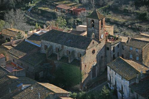 an aerial view of an old castle with roofs at espai Abadia La Trilla in Argentera