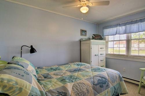 a bedroom with a bed and a ceiling fan at Charming Painter Home with Chesapeake Bay Views in Exmore